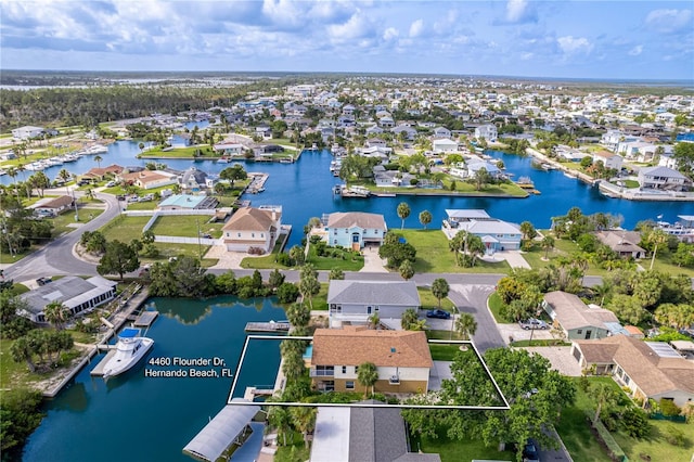4460 Flounder Dr, Hernando Beach, FL 34607 - aerial perspective of suburban area with a nearby body of water and property boundaries highlighted