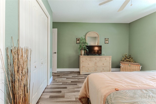 4460 Flounder Dr, Hernando Beach, FL 34607 - bedroom with wood finished floors, ceiling fan, and a closet