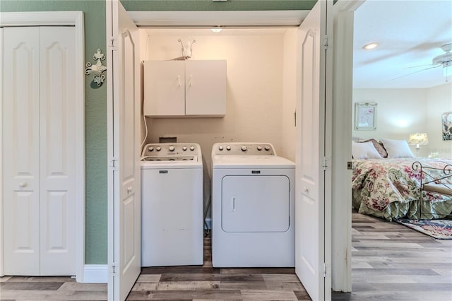 4460 Flounder Dr, Hernando Beach, FL 34607 - laundry area featuring cabinet space, separate washer and dryer, light wood-style floors, a ceiling fan, and recessed lighting