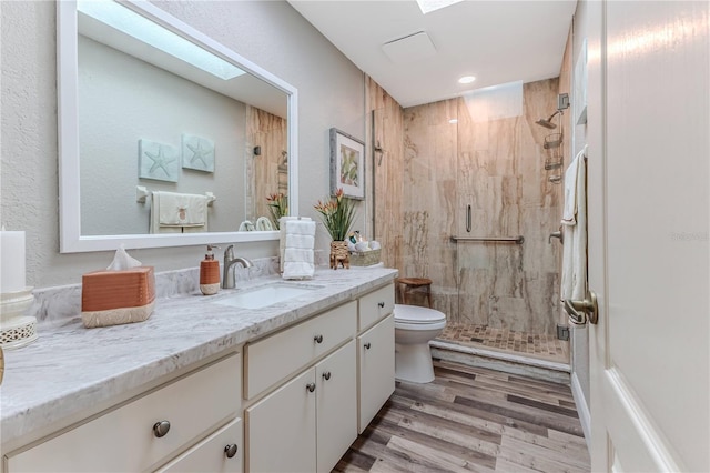 4460 Flounder Dr, Hernando Beach, FL 34607 - full bath featuring vanity, a stall shower, wood finished floors, and recessed lighting