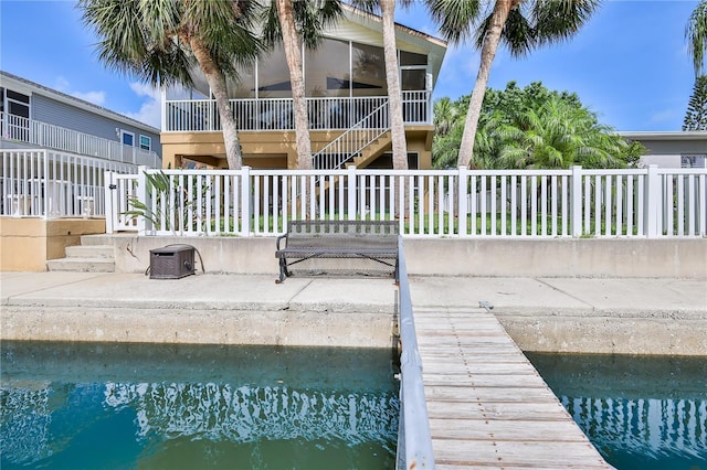 4460 Flounder Dr, Hernando Beach, FL 34607 - swimming pool featuring stairway, a patio, and a sunroom