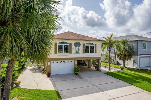 4460 Flounder Dr, Hernando Beach, FL 34607 - view of front of home featuring driveway, a garage, a carport, stucco siding, and a front lawn
