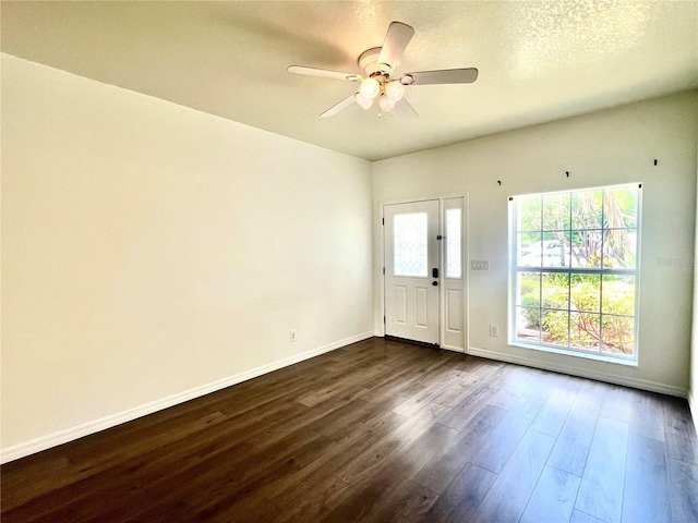 930 Woodbridge Ct, Safety Harbor, FL 34695 - entryway with dark wood-style flooring, a ceiling fan, and baseboards