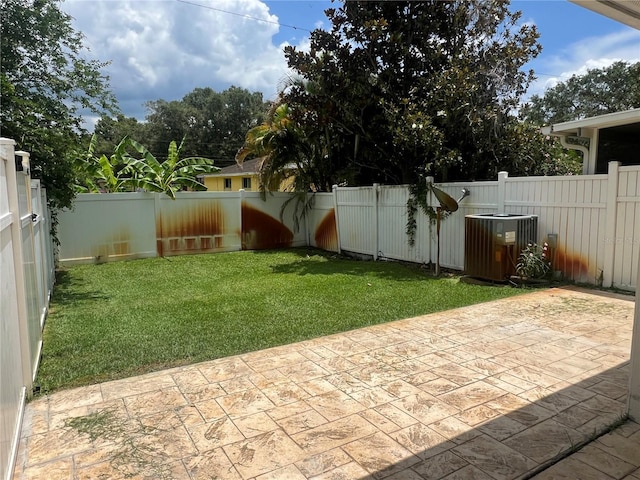 930 Woodbridge Ct, Safety Harbor, FL 34695 - view of yard featuring central AC and a patio