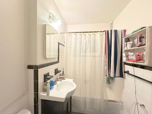 2016 Woodward Ave, Dunedin, FL 34698 - bathroom with tile walls, toilet, and vanity