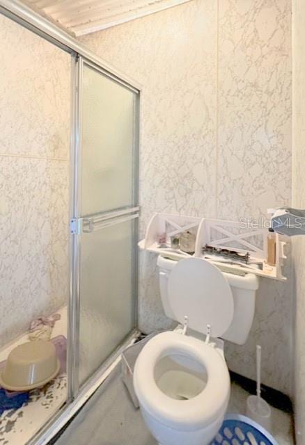 2016 Woodward Ave, Dunedin, FL 34698 - bathroom featuring a shower stall and toilet