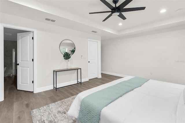 12064 Cradock St, Spring Hill, FL 34608 - bedroom with wood finished floors, baseboards, recessed lighting, a raised ceiling, and a ceiling fan