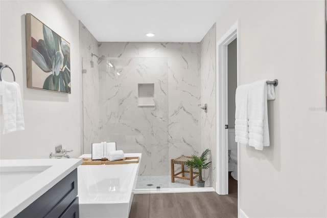 12064 Cradock St, Spring Hill, FL 34608 - bathroom featuring a marble finish shower, vanity, toilet, wood finished floors, and recessed lighting