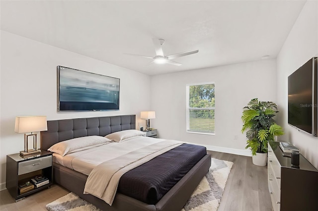 12064 Cradock St, Spring Hill, FL 34608 - bedroom featuring light wood-type flooring, baseboards, and a ceiling fan