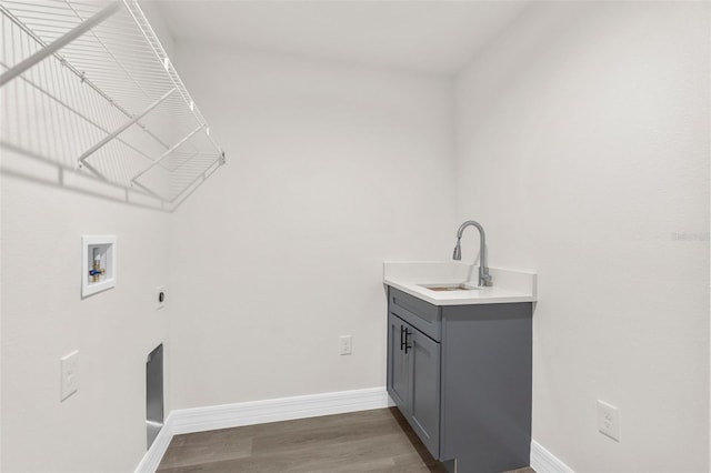 12064 Cradock St, Spring Hill, FL 34608 - laundry area with electric dryer hookup, hookup for a washing machine, cabinet space, and baseboards