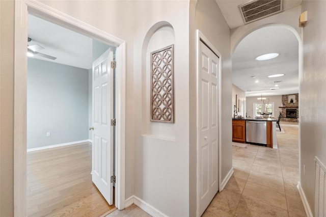 1623 Crossvine Ct, New Port Richey, FL 34655 - hallway with arched walkways and baseboards
