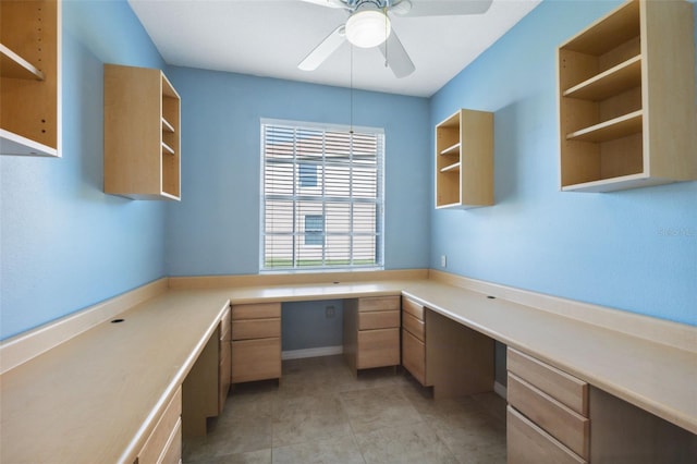 1623 Crossvine Ct, New Port Richey, FL 34655 - unfurnished office featuring built in desk, ceiling fan, and light tile patterned floors