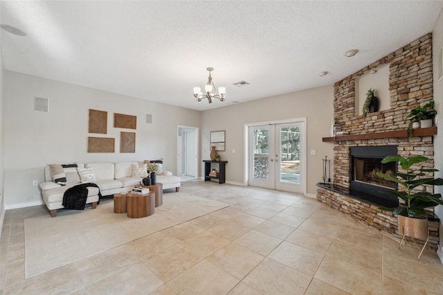 1623 Crossvine Ct, New Port Richey, FL 34655 - living area featuring a fireplace, light tile patterned flooring, a chandelier, french doors, and baseboards