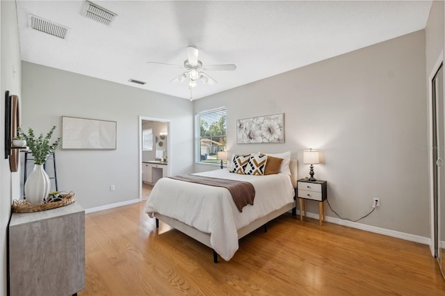 1623 Crossvine Ct, New Port Richey, FL 34655 - bedroom with light wood finished floors, baseboards, a ceiling fan, and ensuite bath