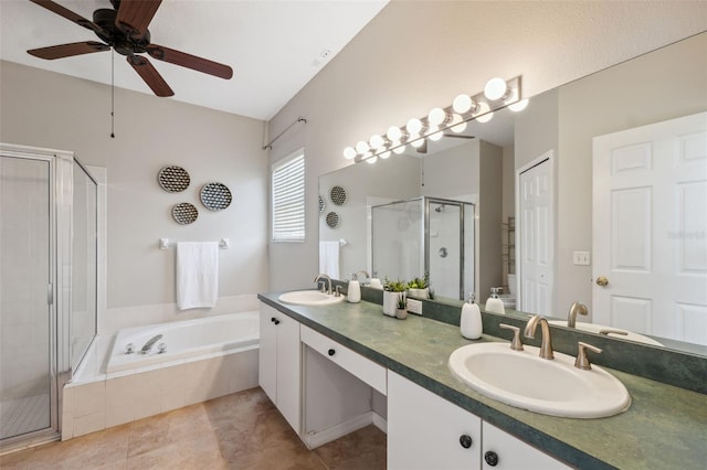 1623 Crossvine Ct, New Port Richey, FL 34655 - bathroom featuring a stall shower, double vanity, a garden tub, ceiling fan, and tile patterned floors