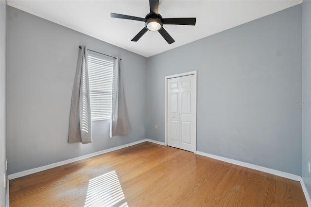 1623 Crossvine Ct, New Port Richey, FL 34655 - empty room with baseboards, wood finished floors, and ceiling fan