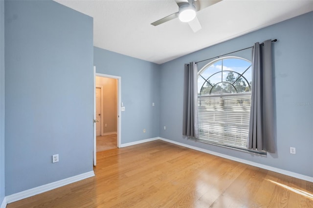 1623 Crossvine Ct, New Port Richey, FL 34655 - unfurnished room with ceiling fan, wood finished floors, and baseboards
