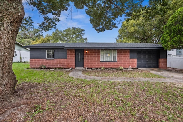 5323 23rd St, Zephyrhills, FL 33542 - ranch-style house with brick siding, an attached garage, and concrete driveway