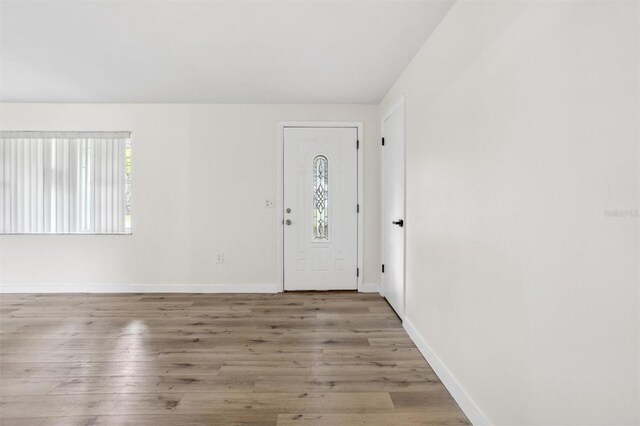 5323 23rd St, Zephyrhills, FL 33542 - entrance foyer featuring baseboards and wood finished floors