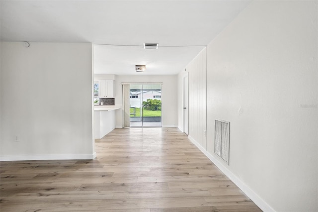 5323 23rd St, Zephyrhills, FL 33542 - hall featuring light wood-style flooring and baseboards