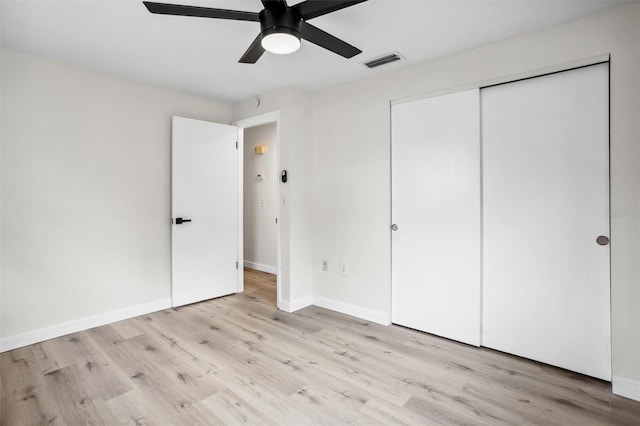 5323 23rd St, Zephyrhills, FL 33542 - unfurnished bedroom featuring light wood finished floors, baseboards, a closet, and ceiling fan