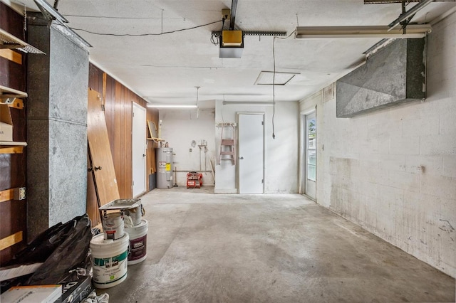 5323 23rd St, Zephyrhills, FL 33542 - garage with water heater and a garage door opener