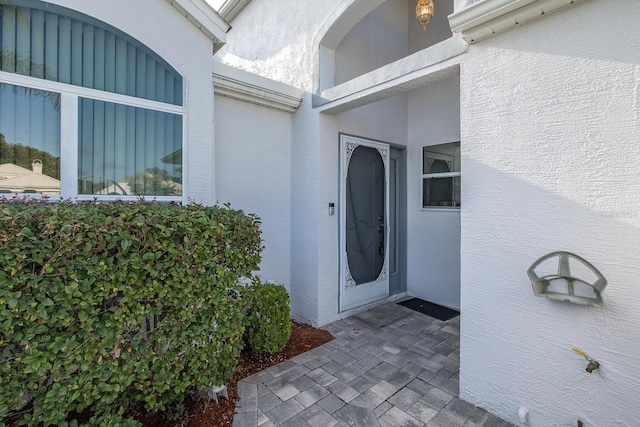 1084 Vista Fina Ct, Spring Hill, FL 34608 - view of exterior entry featuring stucco siding