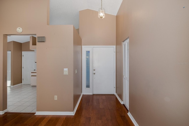 1084 Vista Fina Ct, Spring Hill, FL 34608 - entrance foyer with high vaulted ceiling, wood finished floors, and baseboards