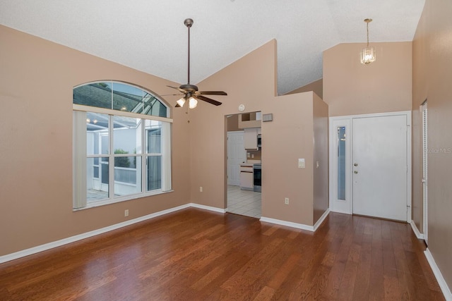 1084 Vista Fina Ct, Spring Hill, FL 34608 - entrance foyer featuring high vaulted ceiling, wood finished floors, ceiling fan, and baseboards