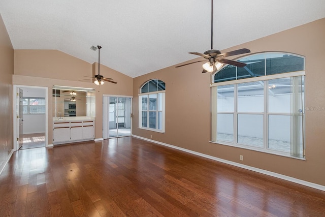 1084 Vista Fina Ct, Spring Hill, FL 34608 - unfurnished living room featuring a ceiling fan, wood finished floors, lofted ceiling, and baseboards