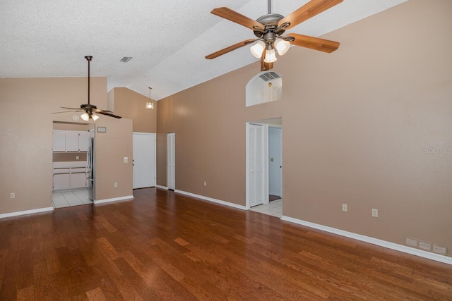 1084 Vista Fina Ct, Spring Hill, FL 34608 - unfurnished living room with a ceiling fan, high vaulted ceiling, wood finished floors, and baseboards