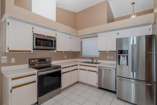 1084 Vista Fina Ct, Spring Hill, FL 34608 - kitchen featuring stainless steel appliances, light countertops, white cabinets, and light tile patterned flooring