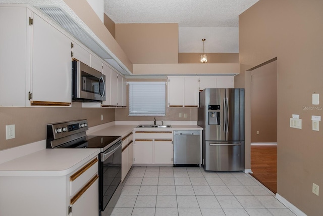 1084 Vista Fina Ct, Spring Hill, FL 34608 - kitchen with appliances with stainless steel finishes, a sink, light countertops, and white cabinets