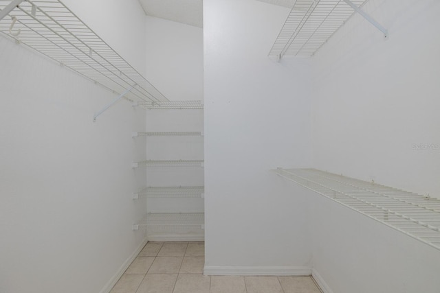 1084 Vista Fina Ct, Spring Hill, FL 34608 - spacious closet featuring light tile patterned flooring