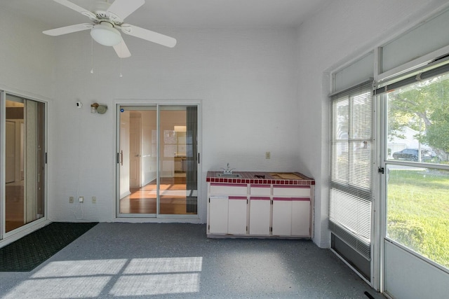 1084 Vista Fina Ct, Spring Hill, FL 34608 - unfurnished sunroom featuring a ceiling fan