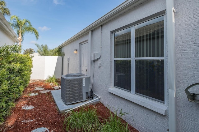 1084 Vista Fina Ct, Spring Hill, FL 34608 - exterior view of central AC and a wood stove