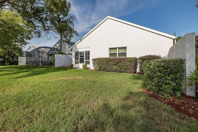 1084 Vista Fina Ct, Spring Hill, FL 34608 - view of green lawn featuring a lanai