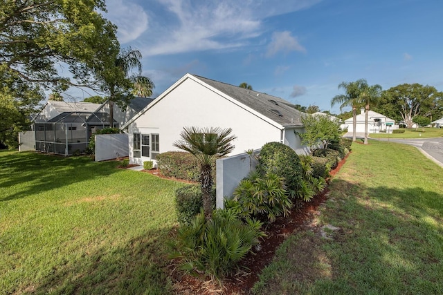 1084 Vista Fina Ct, Spring Hill, FL 34608 - view of home's exterior with stucco siding and a yard