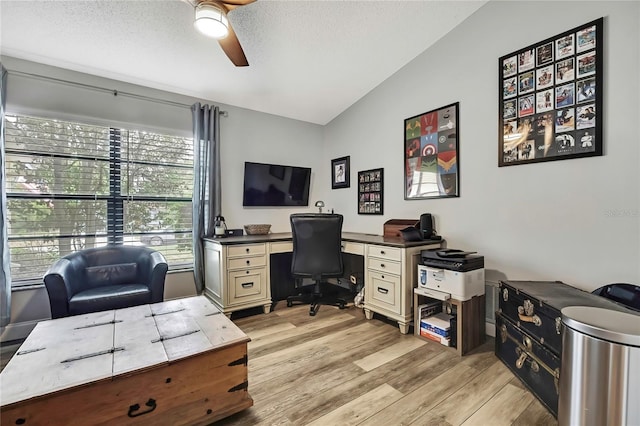 4072 Everett Ave, Spring Hill, FL 34609 - office area featuring vaulted ceiling, ceiling fan, light wood finished floors, and a textured ceiling