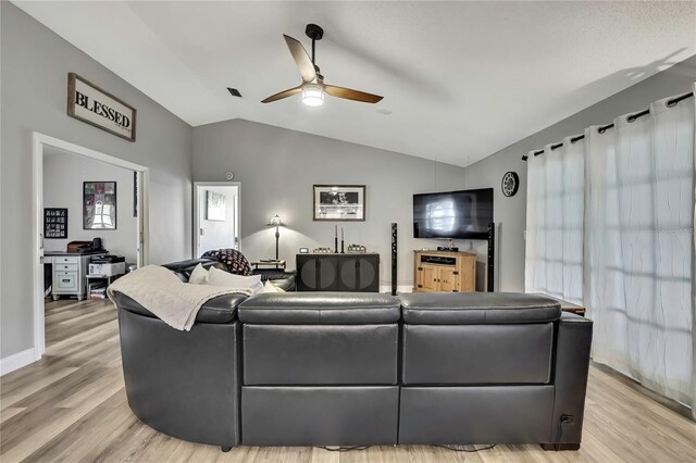 4072 Everett Ave, Spring Hill, FL 34609 - living room featuring ceiling fan, light wood-type flooring, and lofted ceiling
