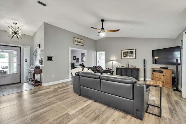 4072 Everett Ave, Spring Hill, FL 34609 - living area featuring vaulted ceiling, light wood-style flooring, ceiling fan, and baseboards