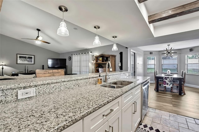 4072 Everett Ave, Spring Hill, FL 34609 - kitchen with a sink, pendant lighting, white cabinets, a ceiling fan, and open floor plan