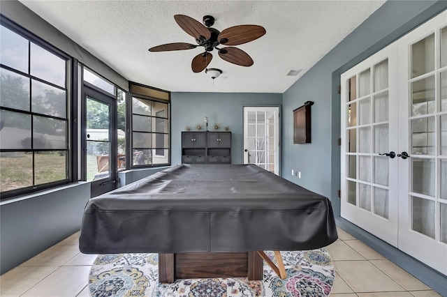4072 Everett Ave, Spring Hill, FL 34609 - playroom featuring french doors, light tile patterned flooring, ceiling fan, a textured ceiling, and billiards