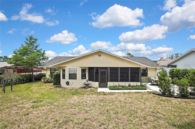 4072 Everett Ave, Spring Hill, FL 34609 - back of property featuring a sunroom, a yard, a patio, and stucco siding