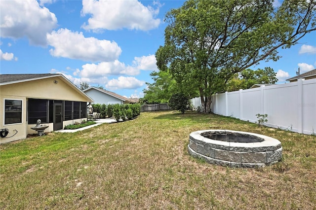 4072 Everett Ave, Spring Hill, FL 34609 - view of yard featuring an outdoor fire pit and a sunroom