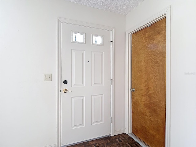 10139 Carrin Rd, Spring Hill, FL 34608 - doorway to outside with a textured ceiling