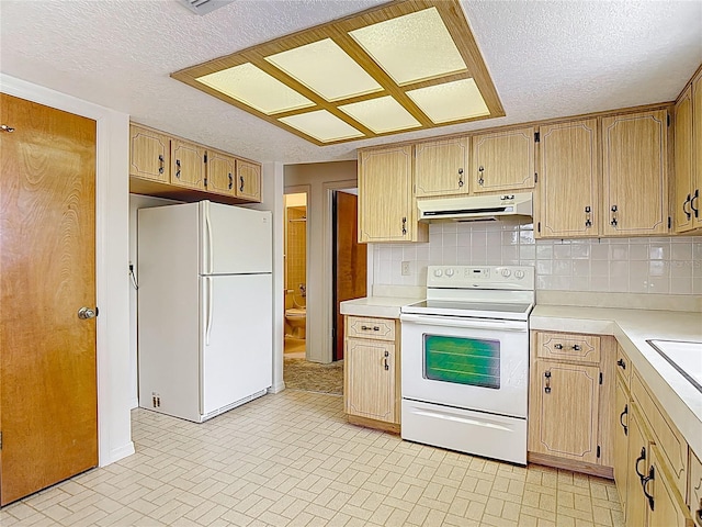 10139 Carrin Rd, Spring Hill, FL 34608 - kitchen featuring white appliances, under cabinet range hood, light countertops, brick patterned flooring, and a textured ceiling