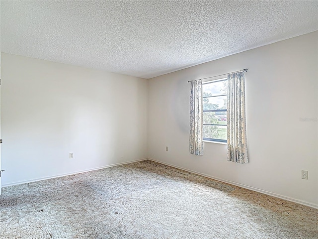 10139 Carrin Rd, Spring Hill, FL 34608 - empty room featuring a textured ceiling and carpet flooring