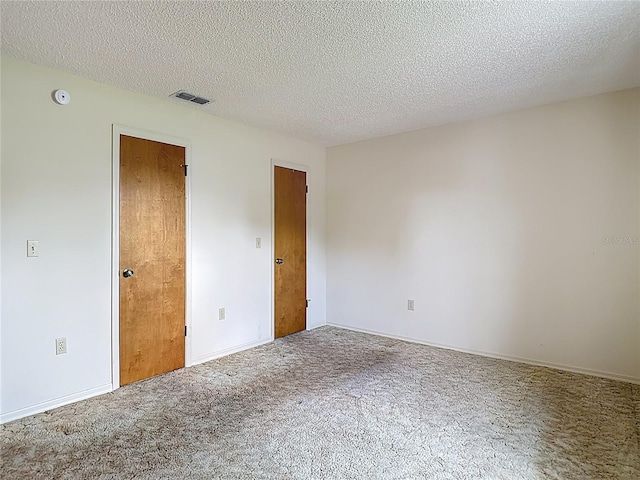 10139 Carrin Rd, Spring Hill, FL 34608 - empty room featuring carpet, a textured ceiling, and a smoke detector