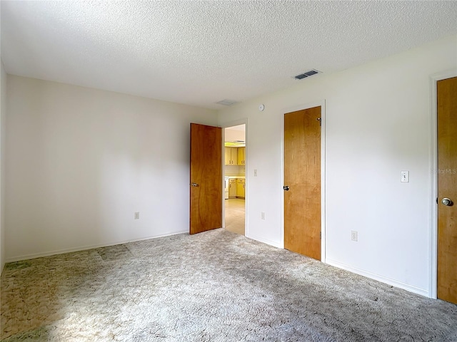 10139 Carrin Rd, Spring Hill, FL 34608 - unfurnished bedroom featuring carpet and a textured ceiling